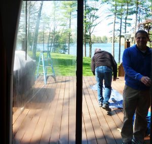 Dirty, cloudy sliding patio door being prepared for replacement by Jake and Tom!