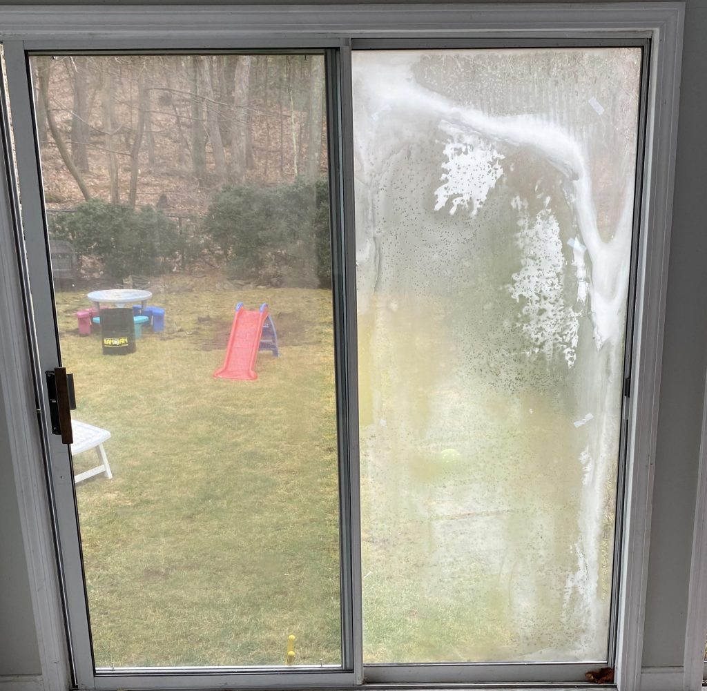 Foggy door with right side glass that needs replacement