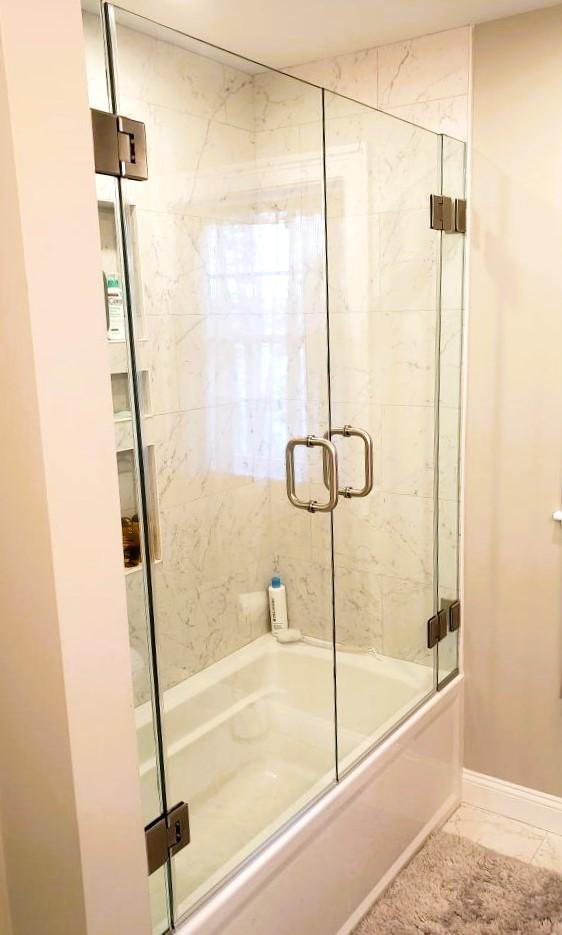 Double glass doors on a bathtub for maximized accessibility.